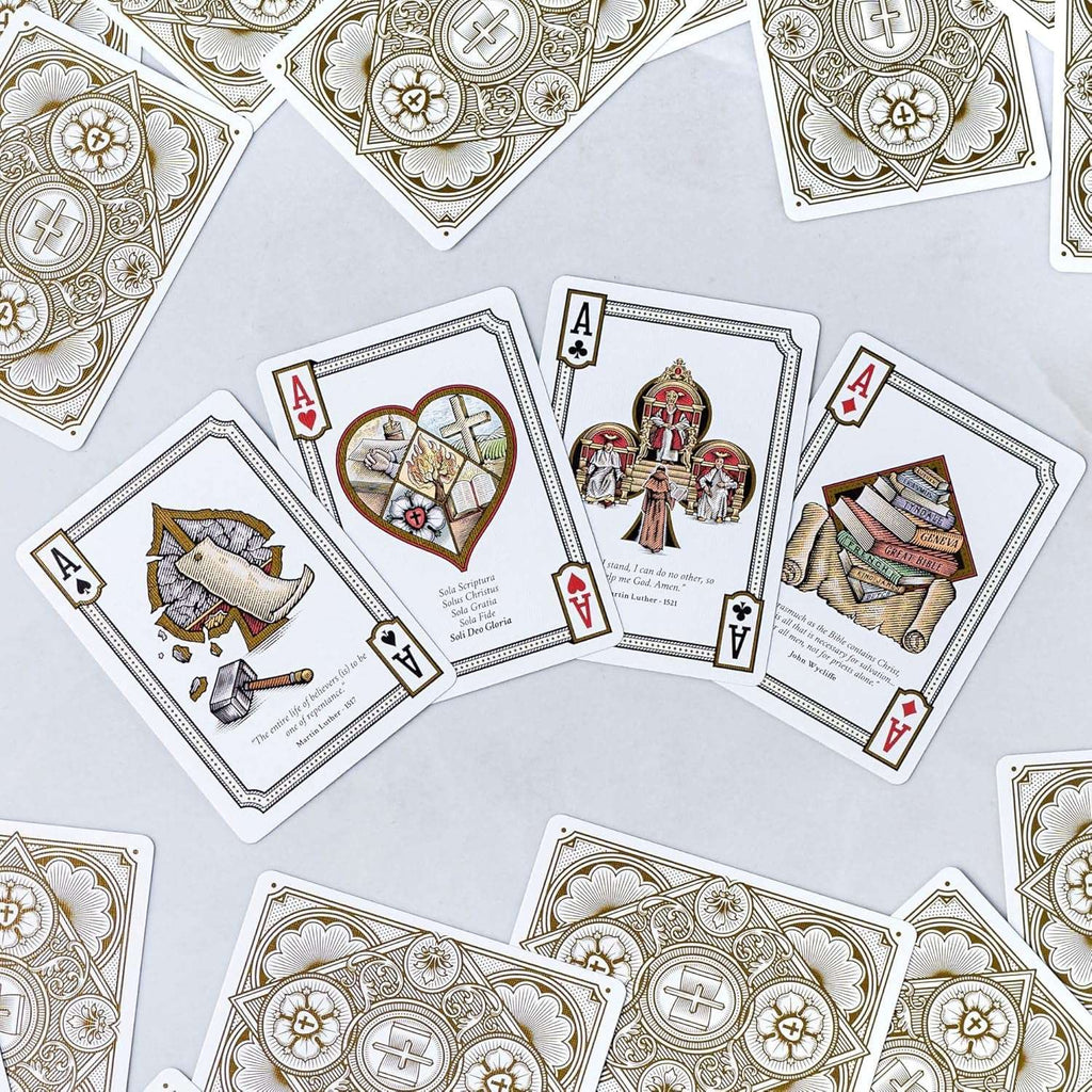 Alpha & Omega premium playing cards with metallic foil tuckbox, available in five collectible designs.