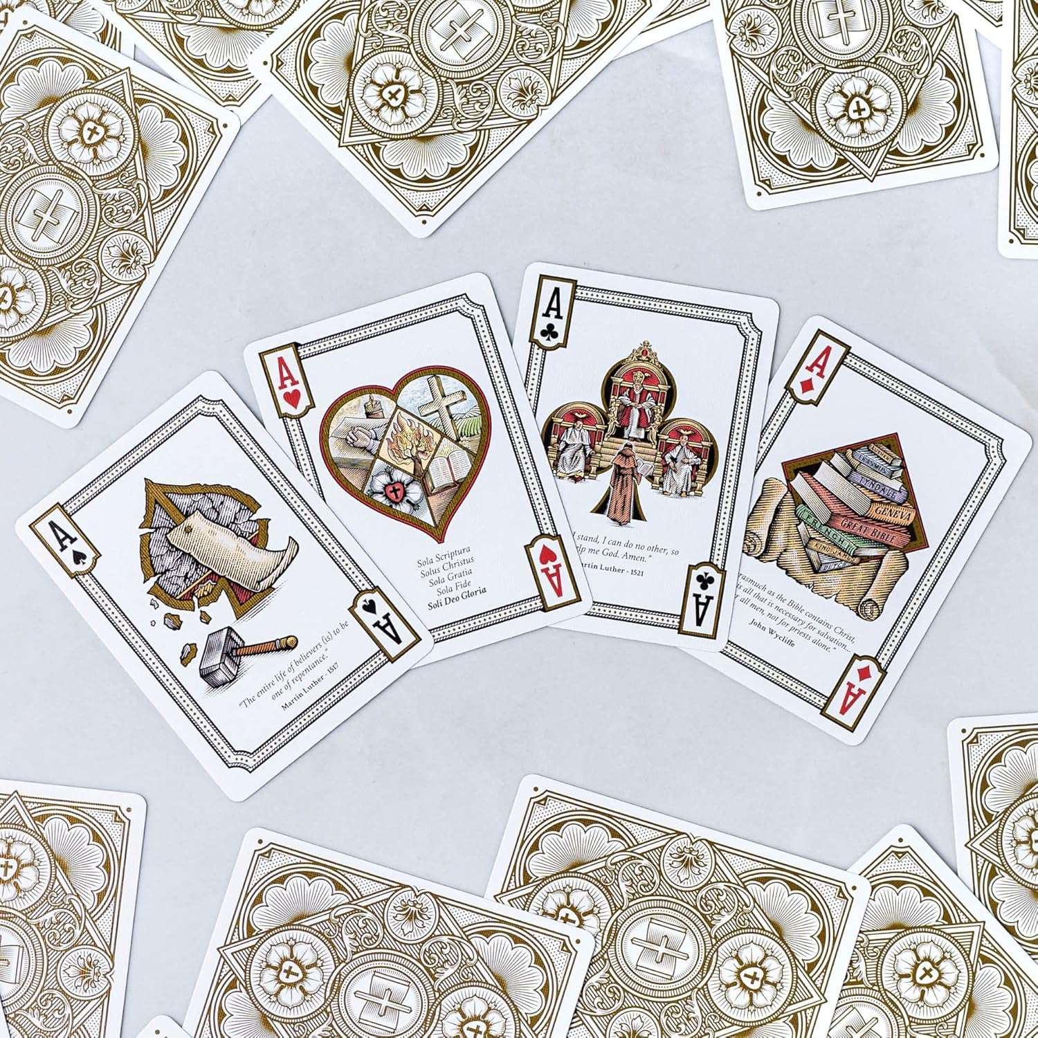 Alpha & Omega premium playing cards with metallic foil tuckbox, available in five collectible designs.