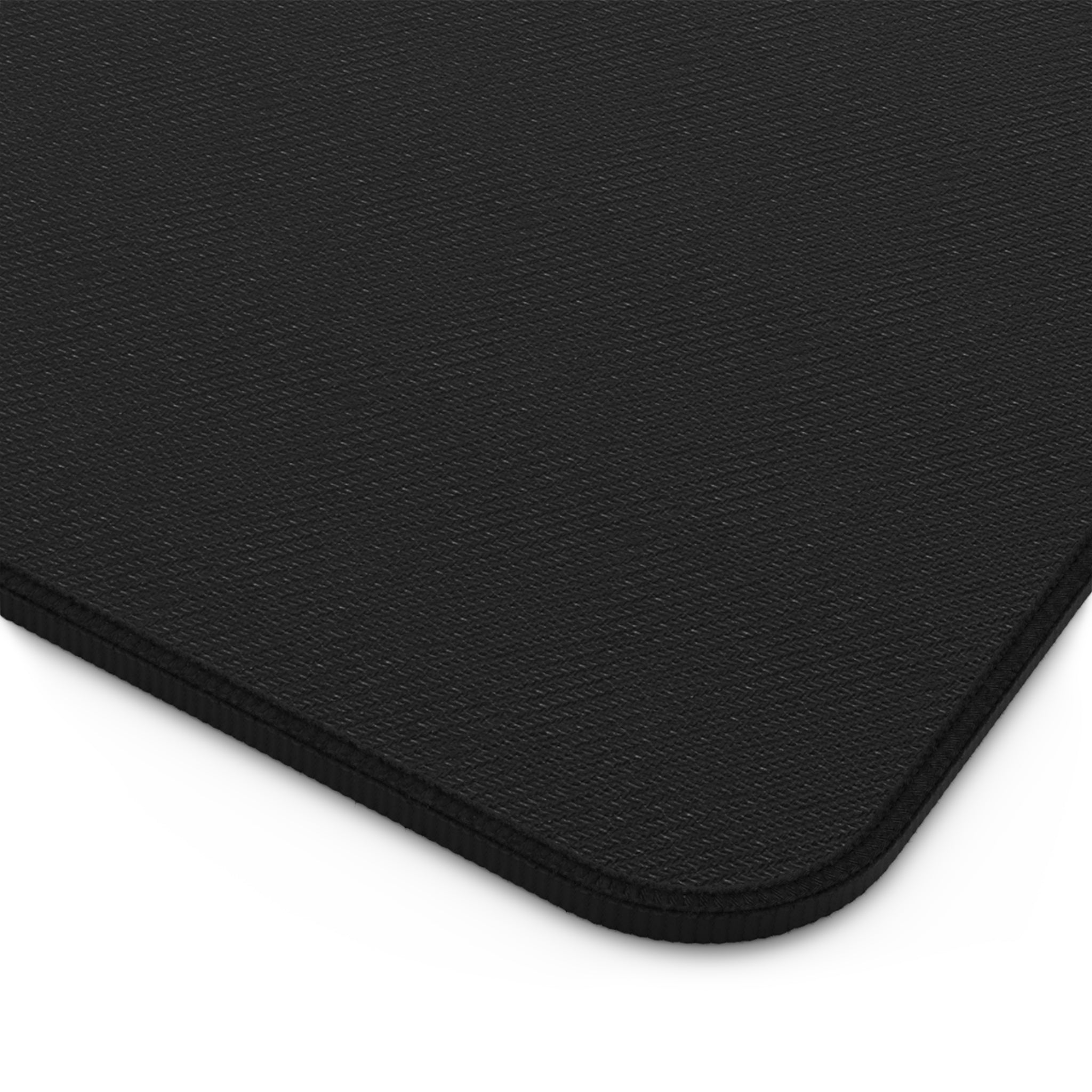 Ascension Grid desk mat with black-and-white sacred geometry rosette, concentric lines, and diamond mandalas on stitched-edge mat
