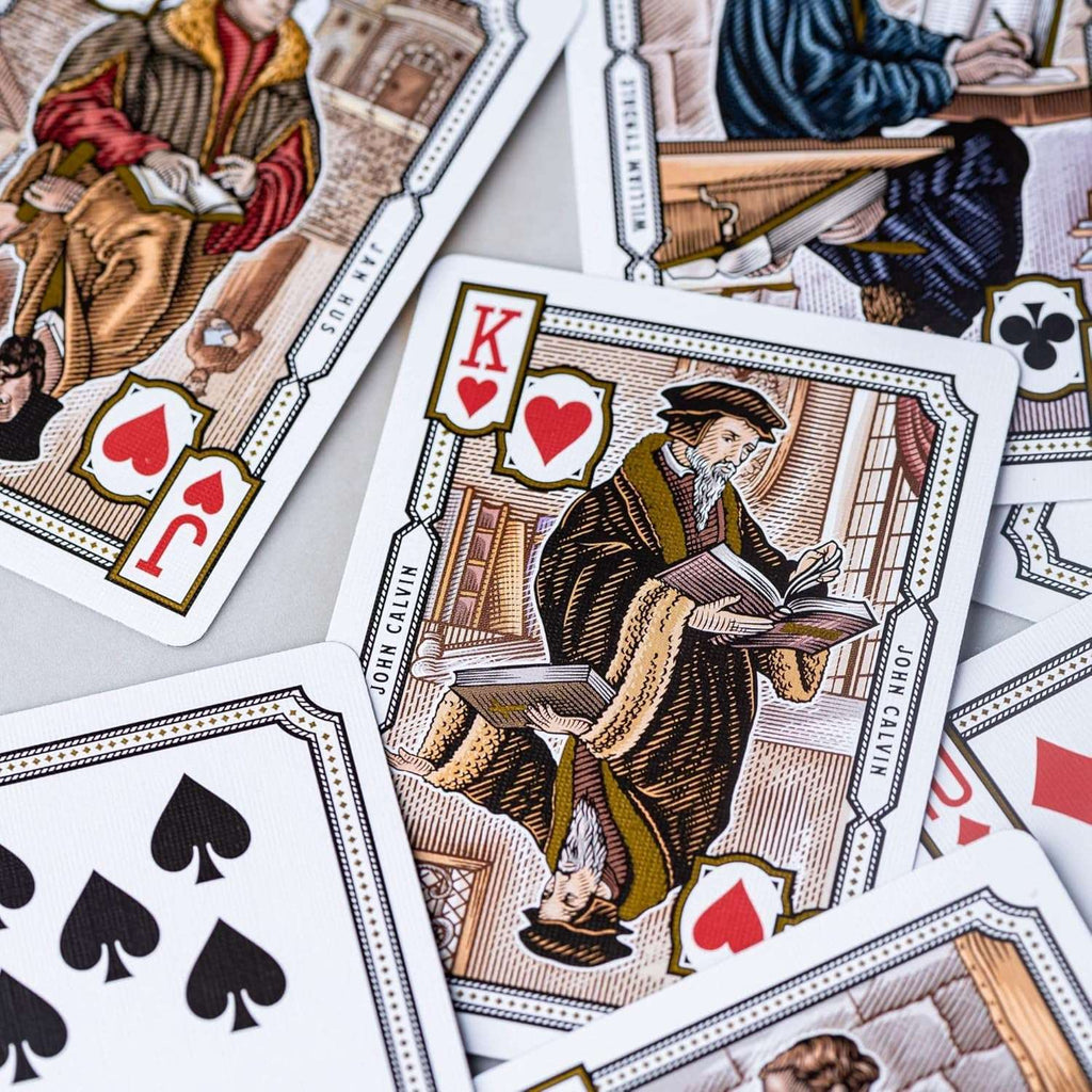 Alpha & Omega premium playing cards with metallic foil tuckbox, available in five collectible designs.
