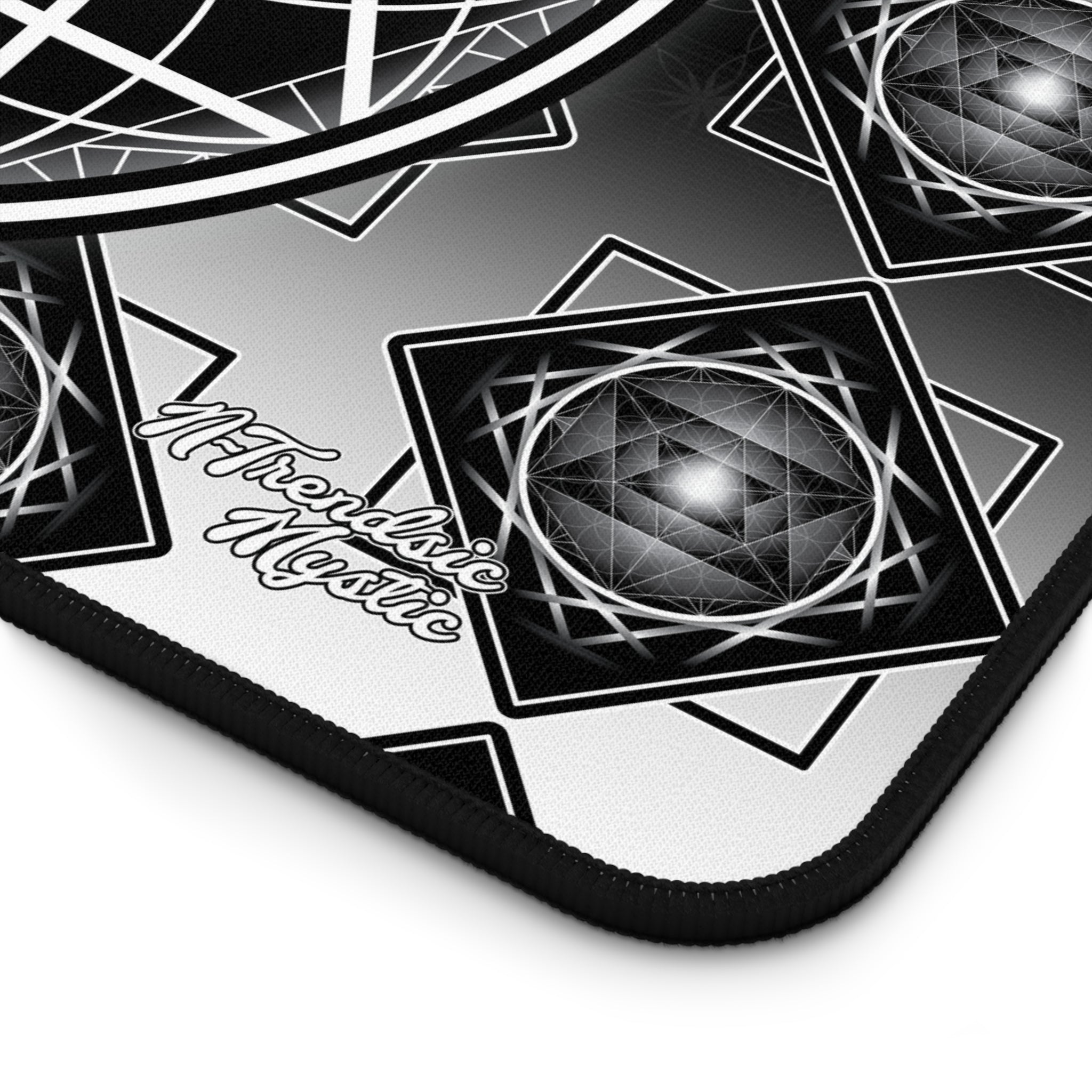 Mouse pad with geometric design and 'Mystical Mystic' branding on a white background