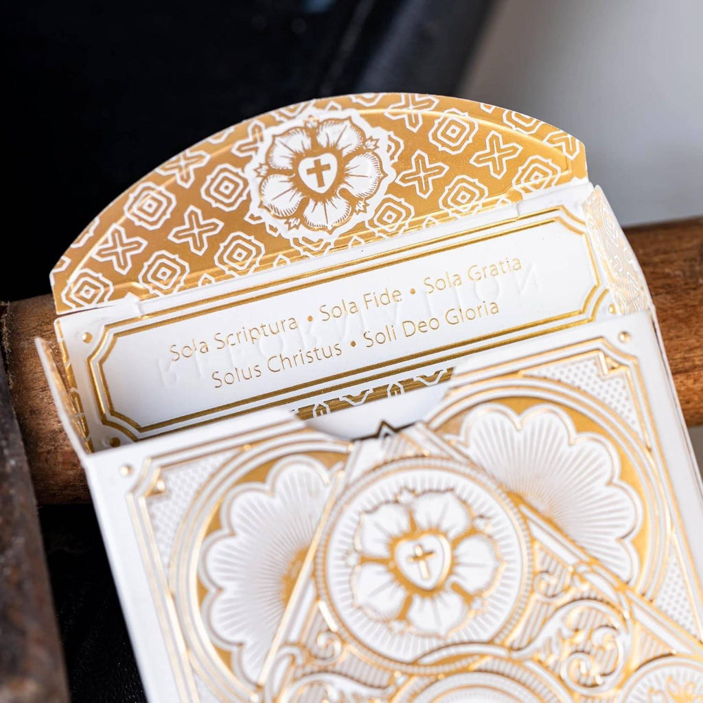 Alpha & Omega premium playing cards with metallic foil tuckbox, available in five collectible designs.