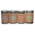 Four metal tins of Ayurvedic herbal tea blends: Hydrate, Cool & Calm, Rooibos Chai, Bliss
