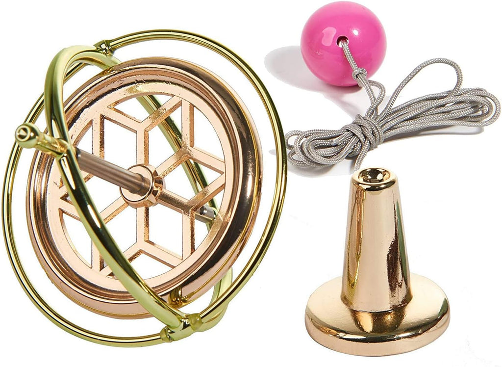 Mystic Anti-Gravity Spinning Top — polished metal precision gyroscope spinning in motion over a tabletop pedestal