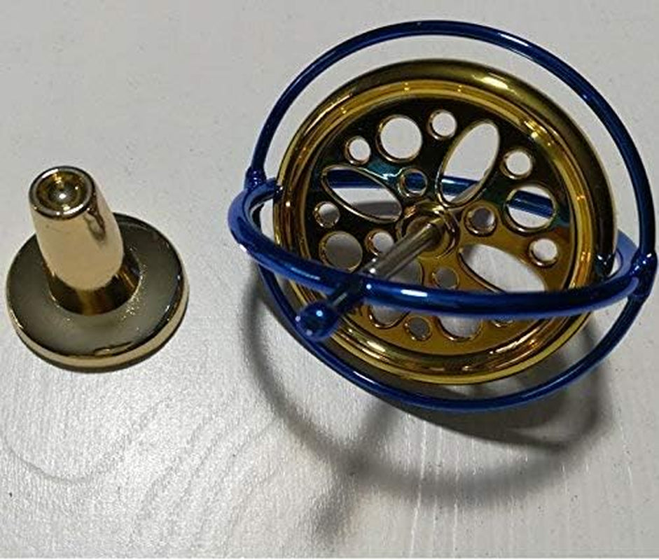 Mystic Anti-Gravity Spinning Top — polished metal precision gyroscope spinning in motion over a tabletop pedestal
