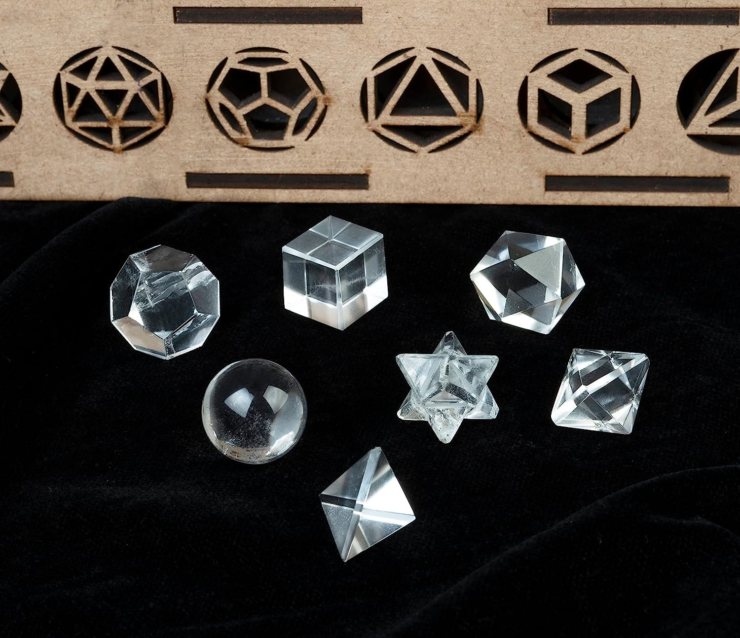 Set of Platonic solid sacred geometry crystals in multiple gemstone options, hand-carved 15–20mm pieces for meditation, grids, or display.