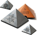 Mystic Shungite pyramid crystal — 2″ polished black stone with engraved sacred geometry: Flower of Life, Merkaba Star, or Metatron’s Cube