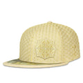 Yellow textured cap with geometric design on a white background