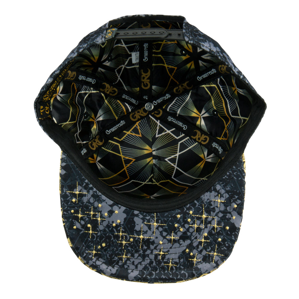 Cap with geometric pattern on front and starry night design on back