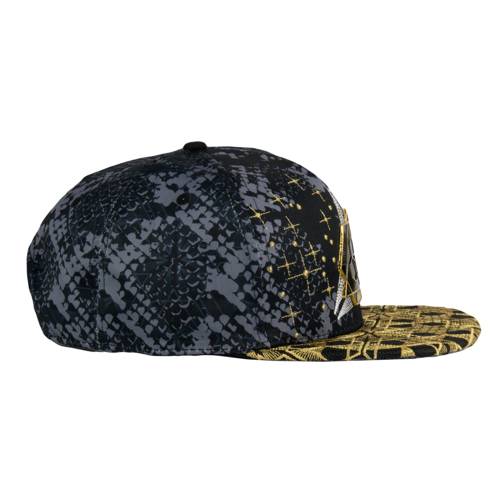 Black and gold patterned cap on a white background