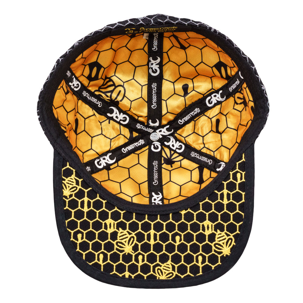 Hexagonal patterned cap with visible branding on a white background