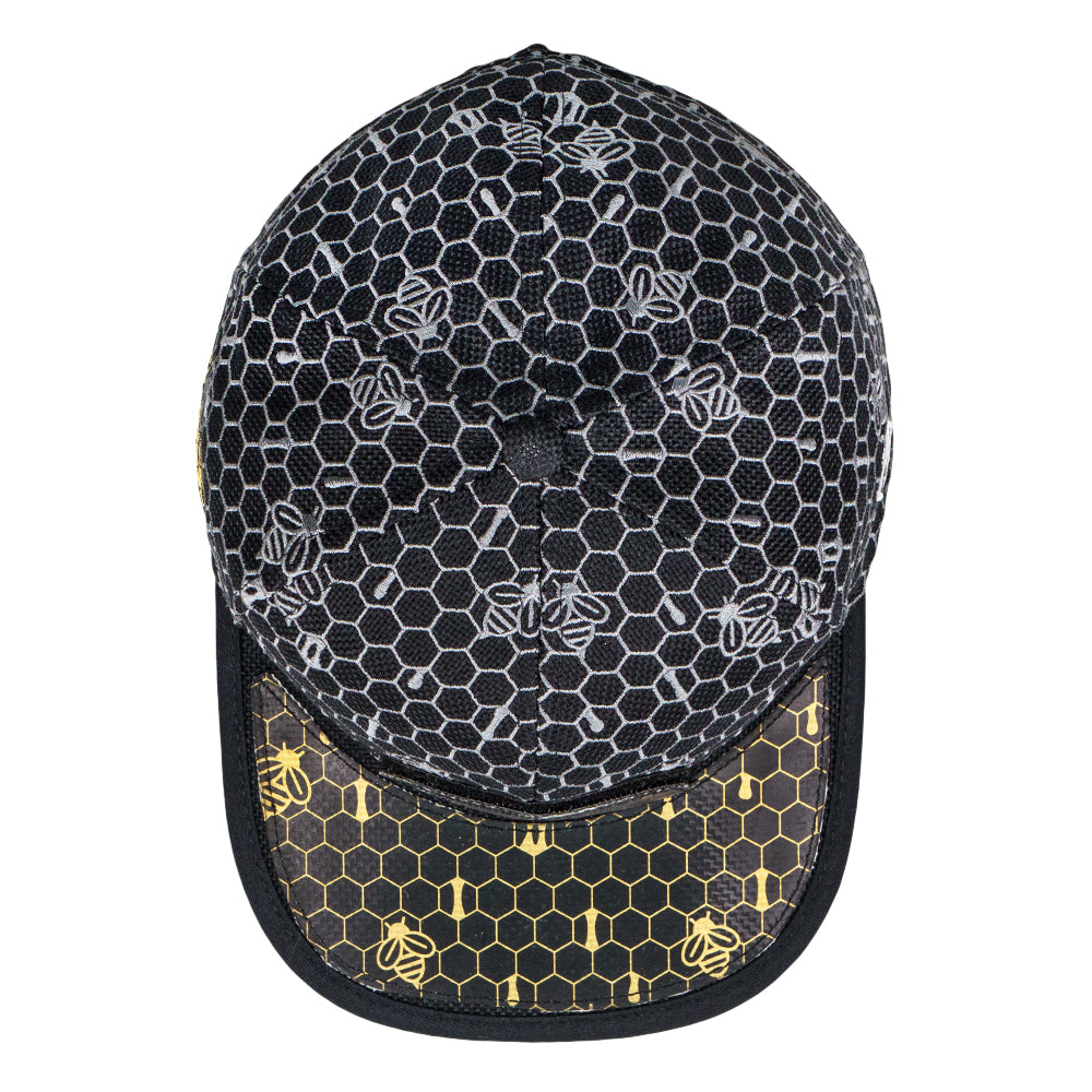 Cap with honeycomb and bee pattern on a white background
