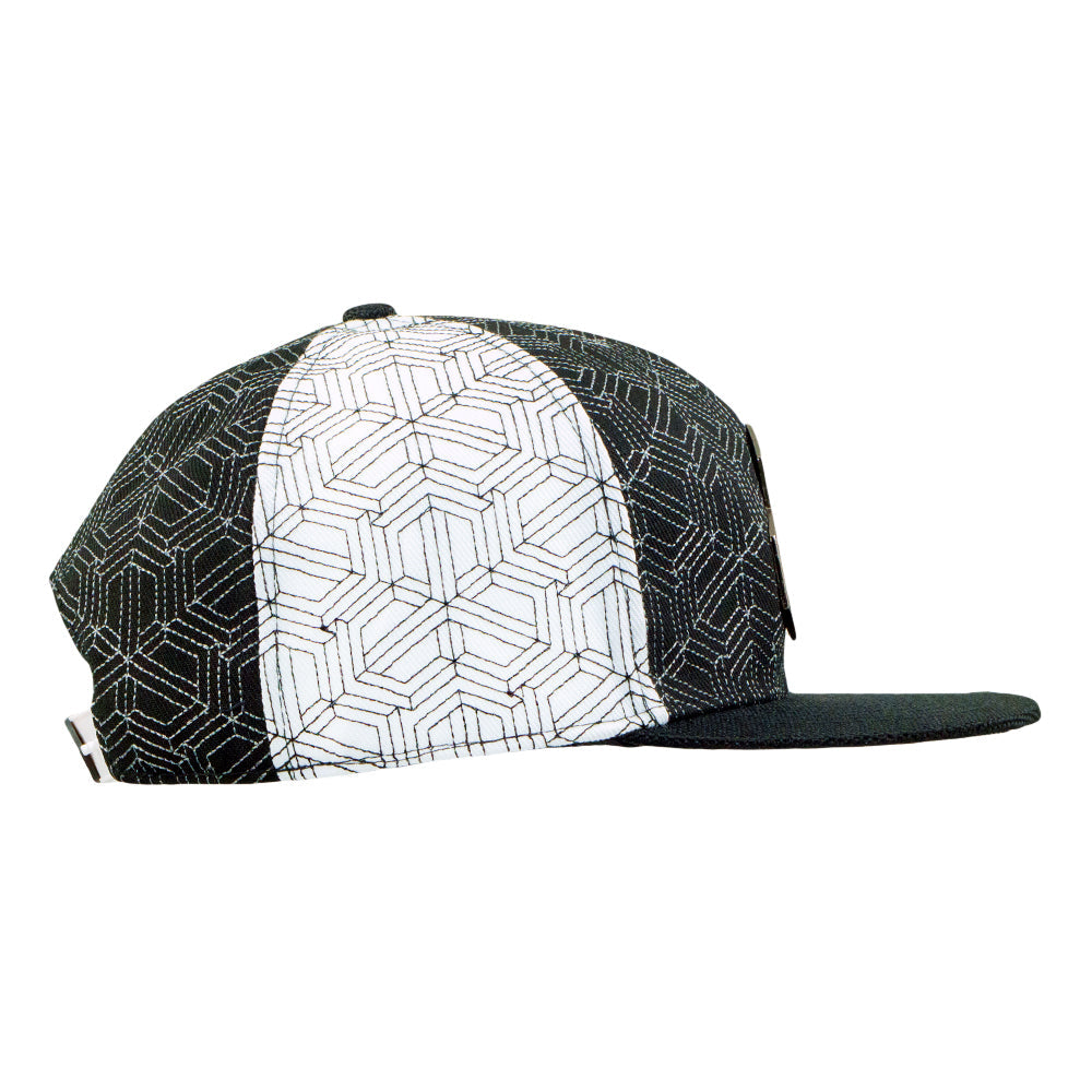 Black and white cap with geometric pattern on a white background