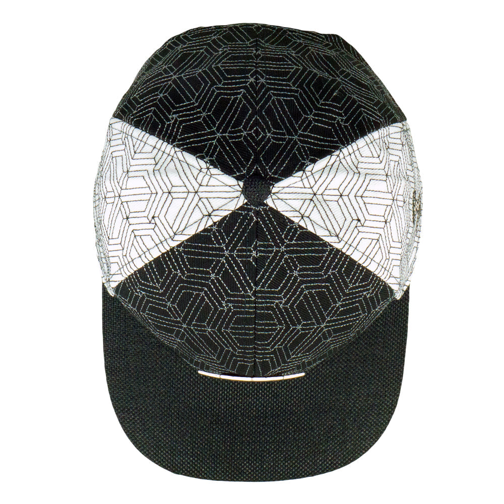 Black and white geometric patterned cap on a white background