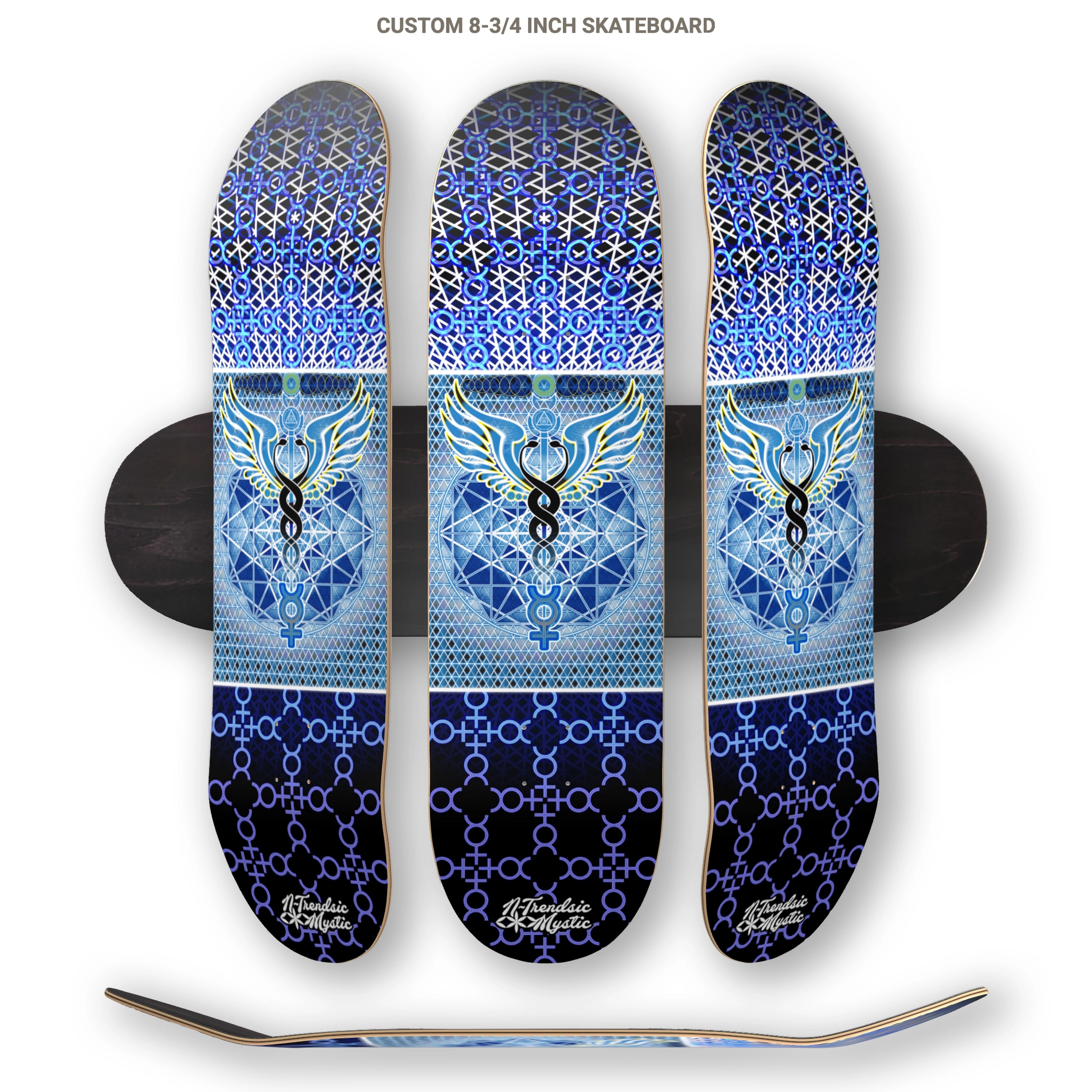 Three skateboard decks with blue and black geometric patterns on a white background