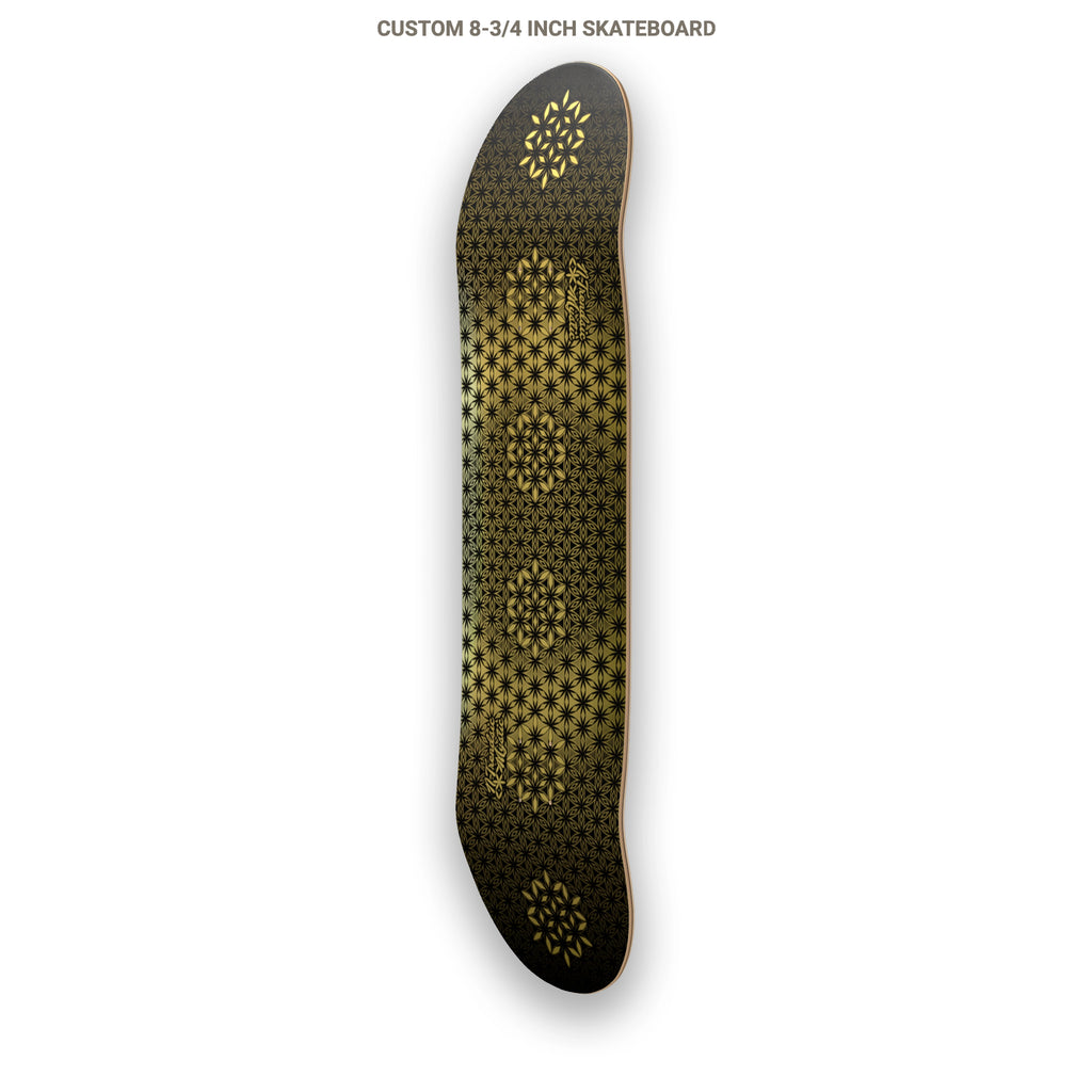 The Armory gold foil sacred geometry skateboard deck with repeating Flower of Life pattern on 7-ply Canadian maple, designed by NTrendSic Mystic.