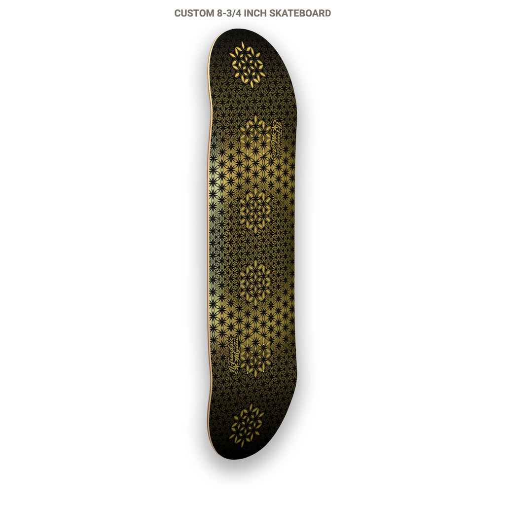 The Armory gold foil sacred geometry skateboard deck with repeating Flower of Life pattern on 7-ply Canadian maple, designed by NTrendSic Mystic.