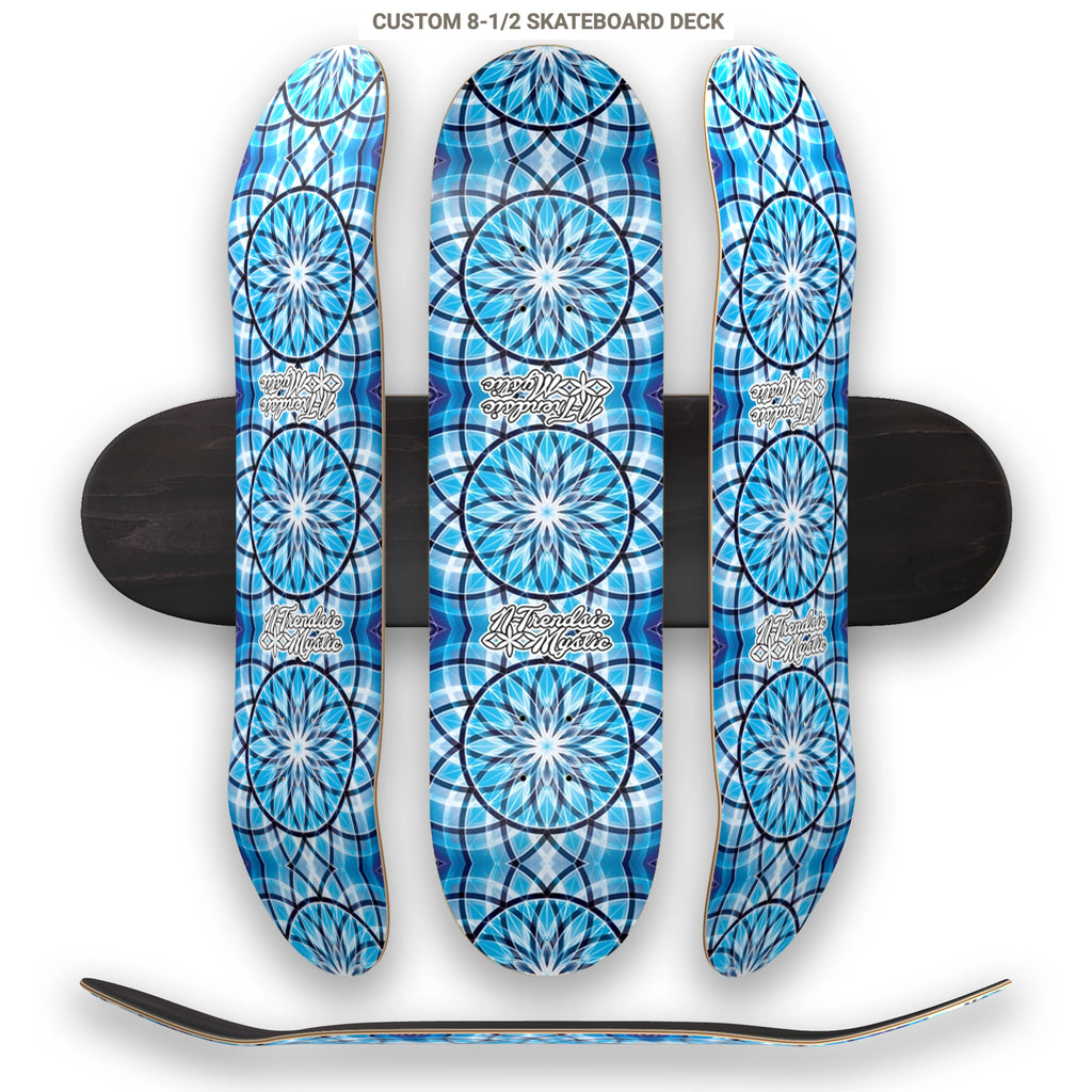 Three blue patterned skateboard decks stacked on top of each other with a white background.