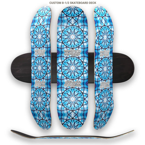 Three blue patterned skateboard decks stacked on top of each other with a white background.
