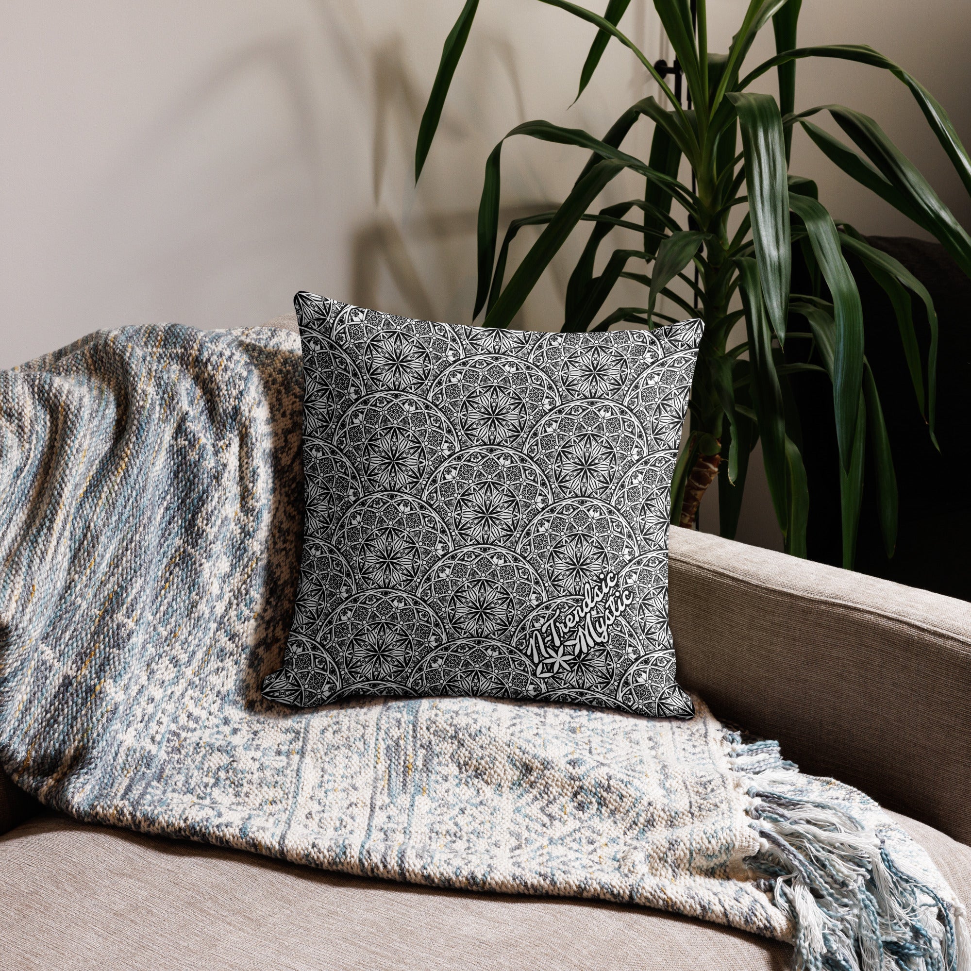 Mystic Eyes premium pillow — repeating sacred geometry mandala pattern with all-seeing eyes in black-and-white