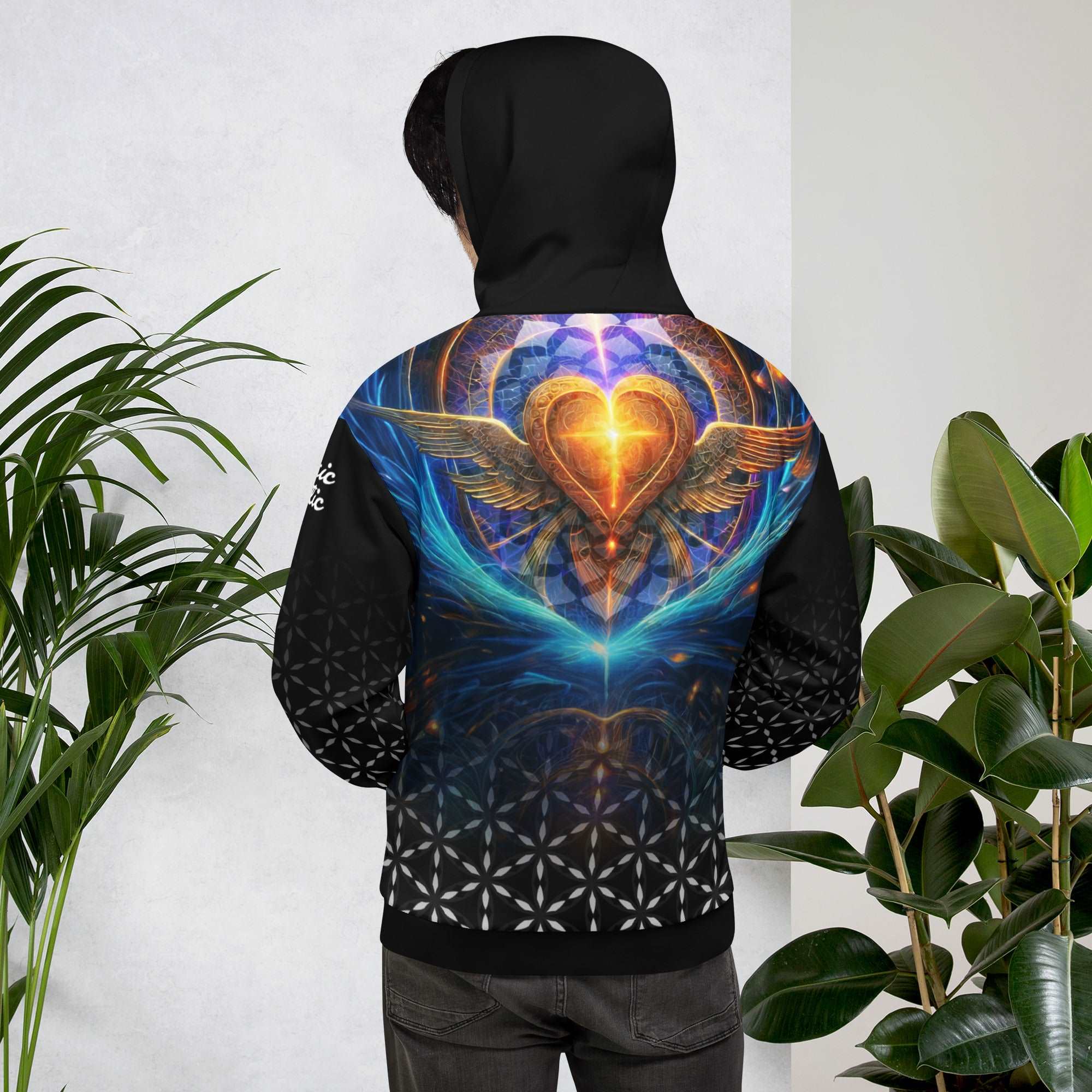 Mystic Wings hoodie — golden heart with cosmic wings back art, Flower of Life fade front, golden sacred geometry hood lining