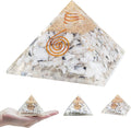 Handcrafted gemstone orgone pyramid with copper coil design, available in multiple decorative variations.