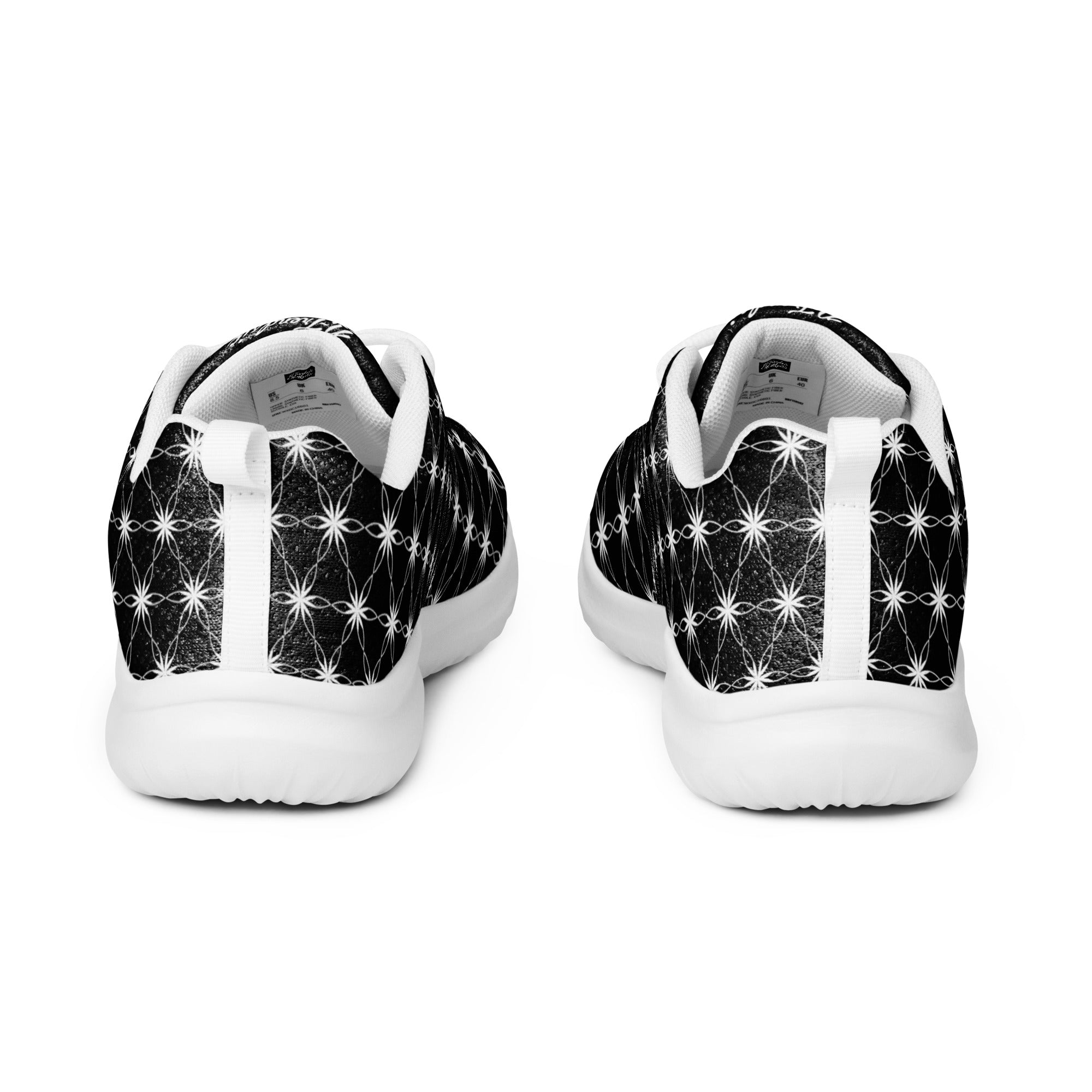 Men’s athletic shoes with all-over black-and-white Flower of Life pattern, white sole, and NTrendSic Mystic branding.