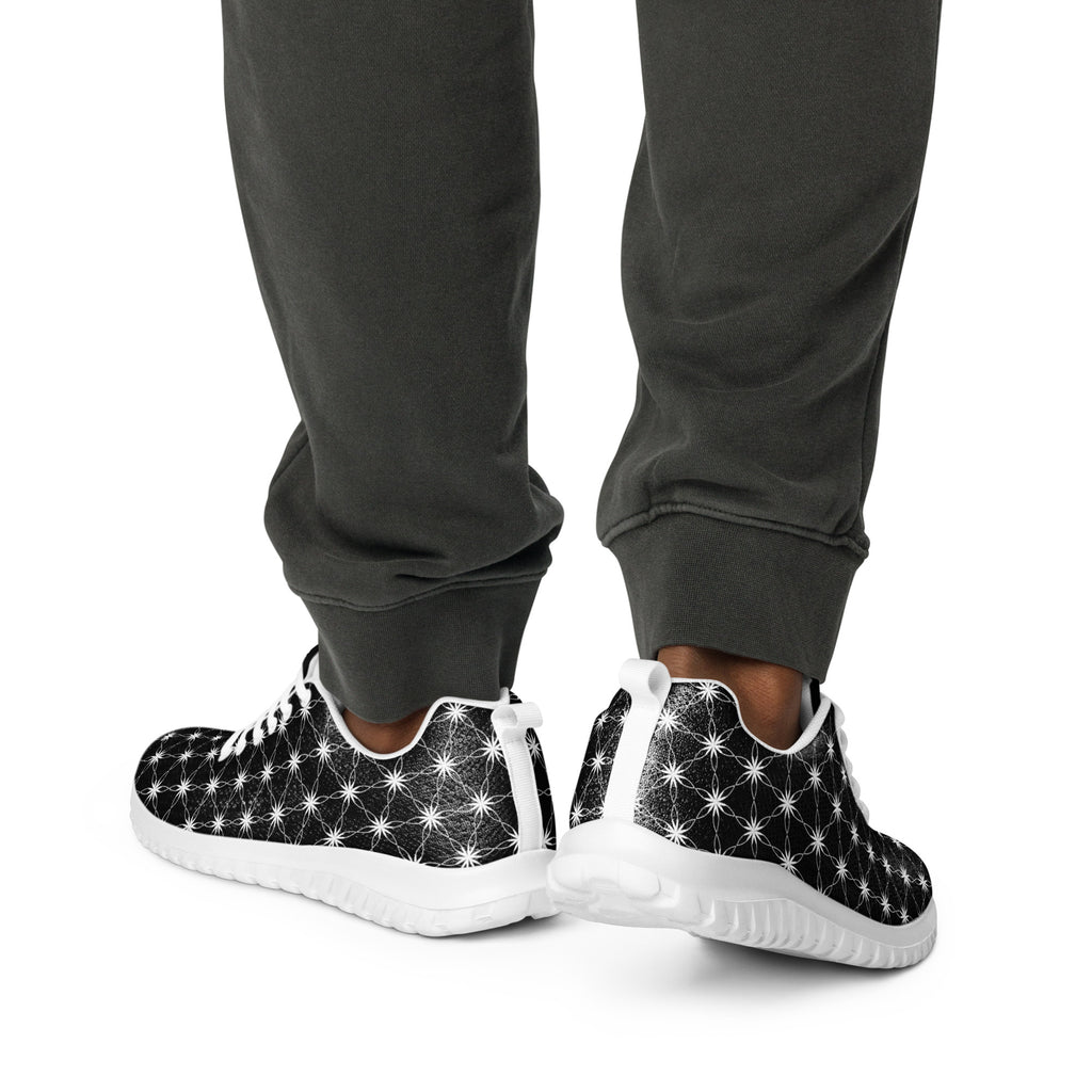 Men’s athletic shoes with all-over black-and-white Flower of Life pattern, white sole, and NTrendSic Mystic branding.