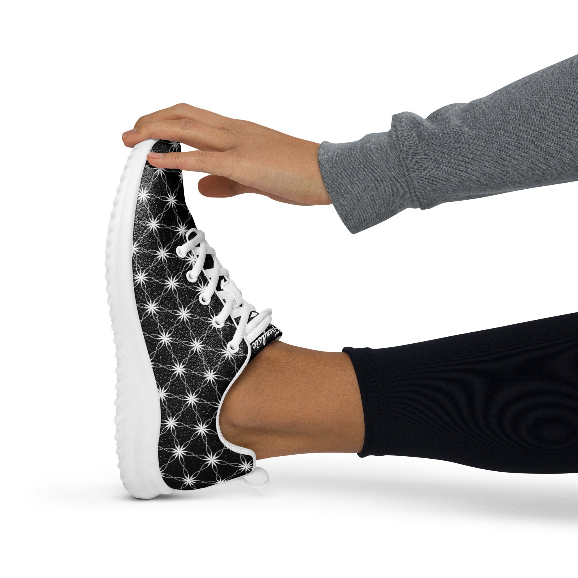Women’s athletic shoes featuring all-over black-and-white Flower of Life pattern, white sole, and NTrendSic Mystic logo.