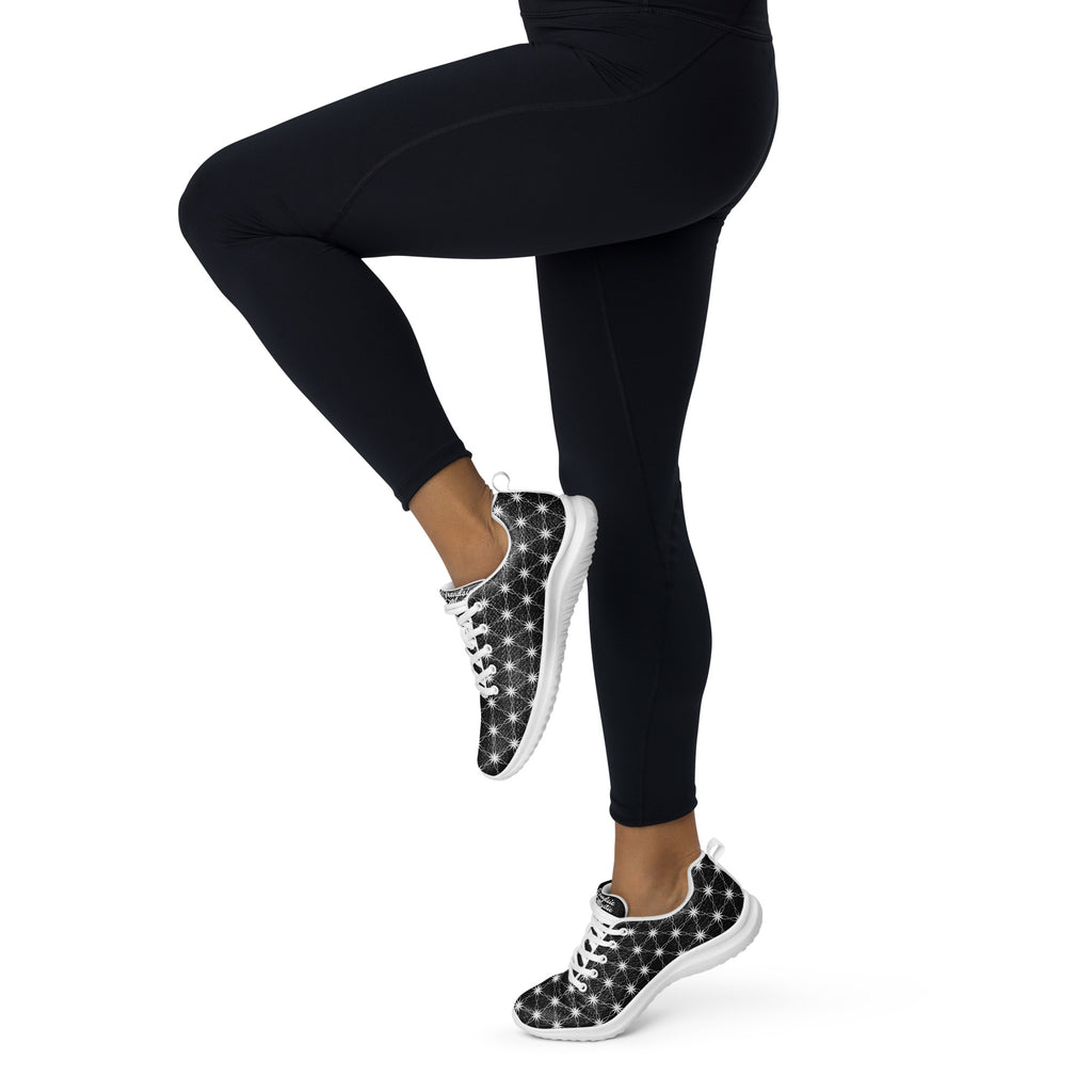 Women’s athletic shoes featuring all-over black-and-white Flower of Life pattern, white sole, and NTrendSic Mystic logo.